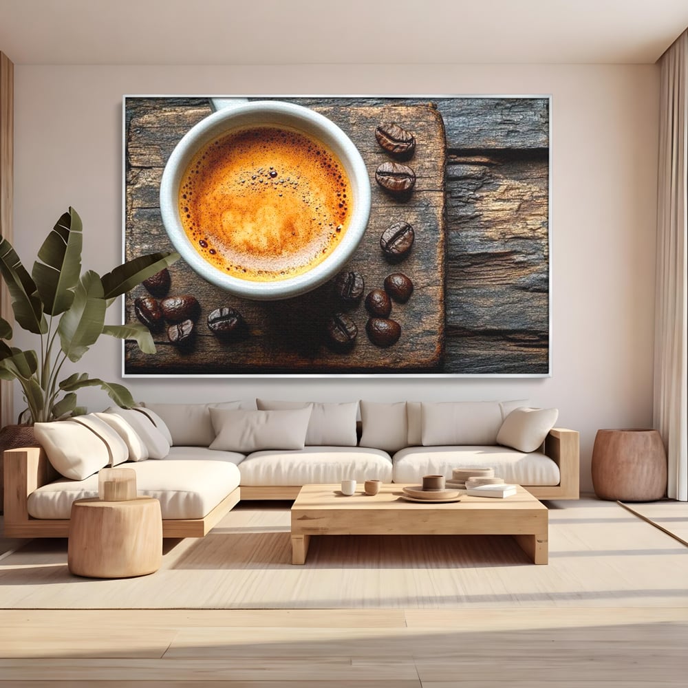 Tablou canvas cu ceasca de espresso si boabe de cafea, in rama de aluminiu argintiu, pe perete intr-un living